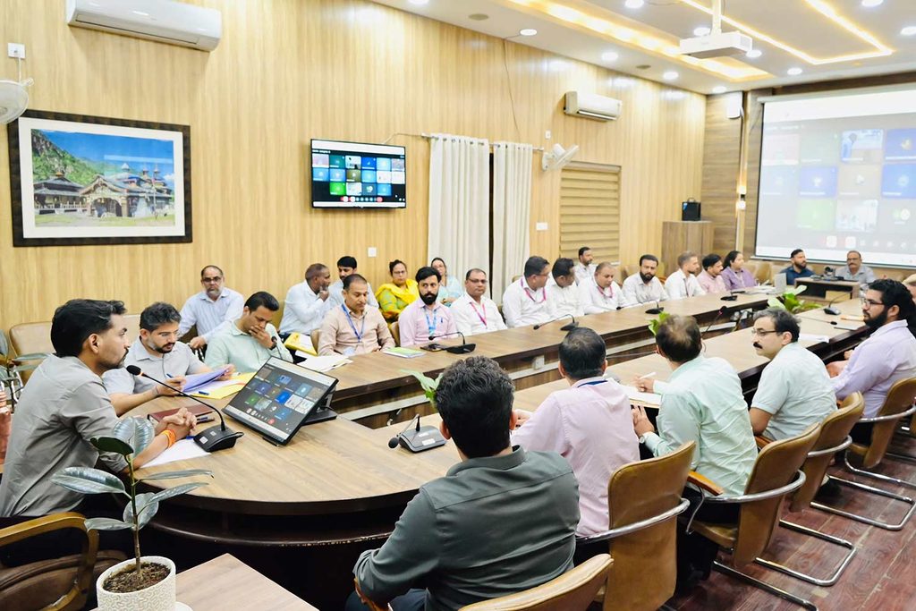 District Magistrate Ashish Chauhan taking the meeting.